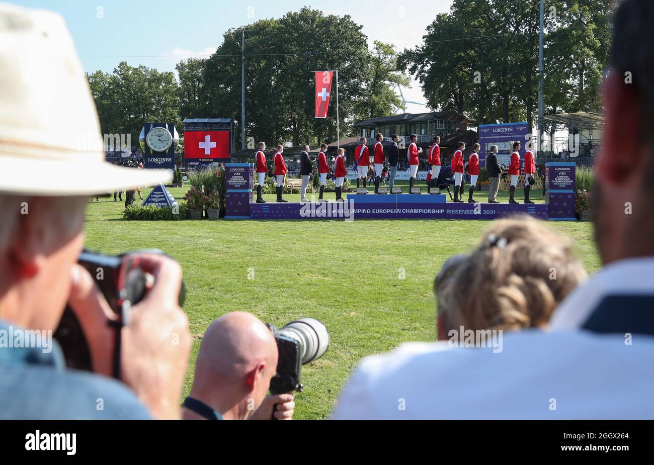 Riesenbeck, Germany. 03rd Sep, 2021. Equestrian sport: European  Championships, Show Jumping. The show jumpers from Germany (l-r, silver),  Switzerland (gold) and Belgium (bronze) stand on the podium at the award  ceremony after