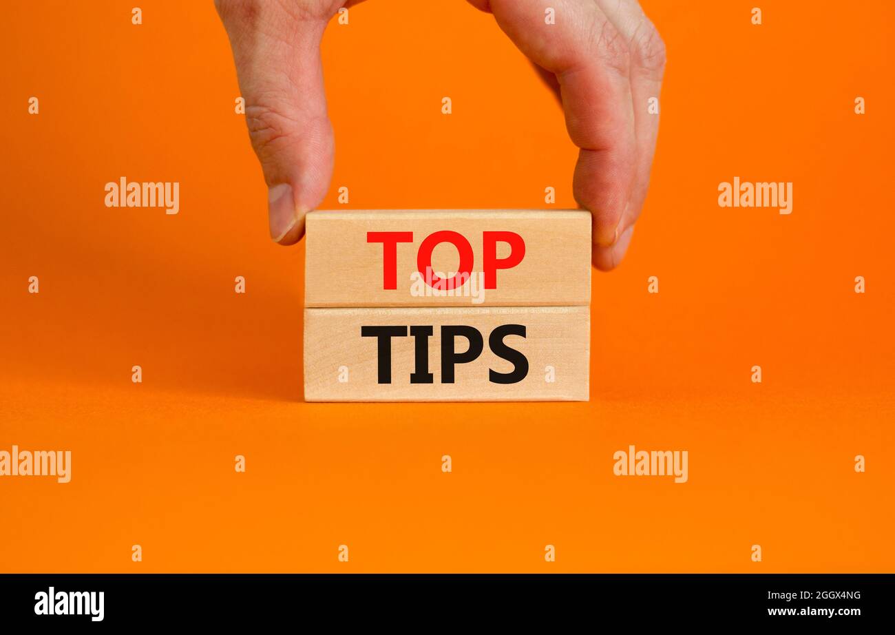 Toops Tips Top tips symbol. Concept words Top tips on wooden blocks on a beautiful ...