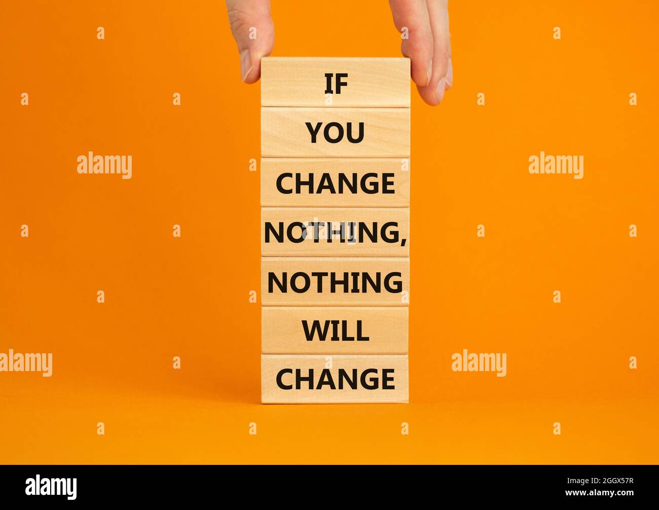 Change symbol. Wooden blocks with words 'If you change nothing, nothing