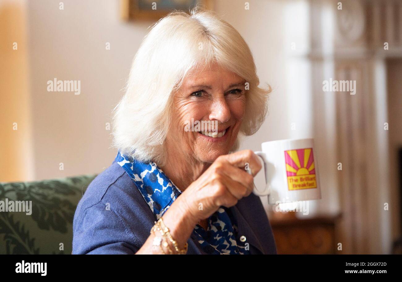 The Duchess of Cornwall takes a drink during a meeting with young women, who have been supported by the Prince's Trust, ahead of the charity's Brilliant Breakfast campaign, during a reception at Clarence House, London. Picture date: Friday September 3, 2021. Stock Photo