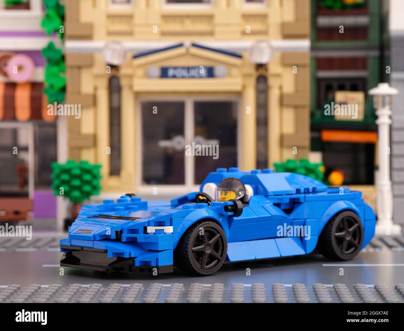 Tambov, Russian Federation - July 02, 2021 Lego McLaren Elva car by LEGO Speed Champions with driver inside on a Lego city street. Stock Photo