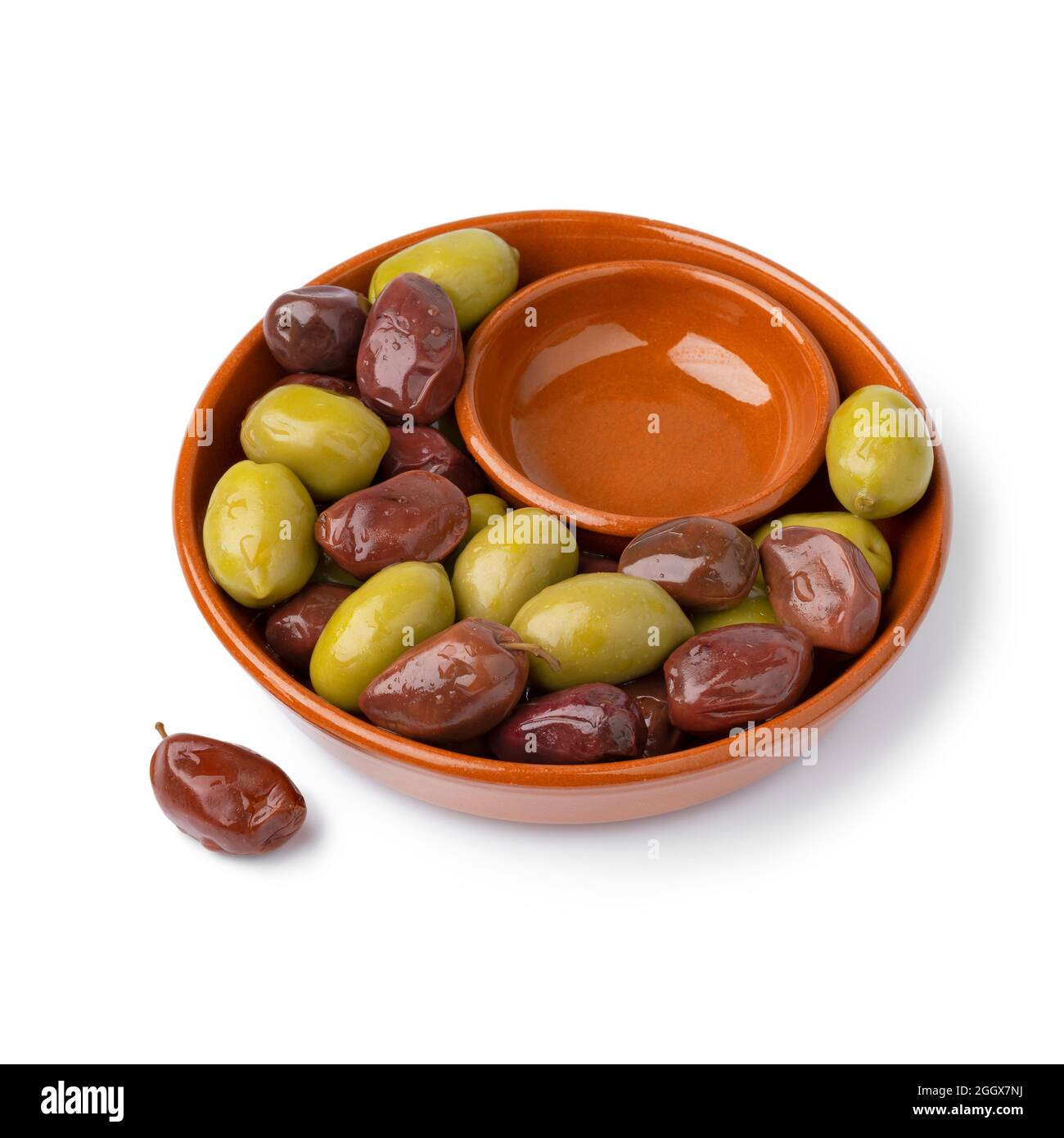 Bowl with Greek green and Kalamata olives close up for a snack isolated on white background Stock Photo