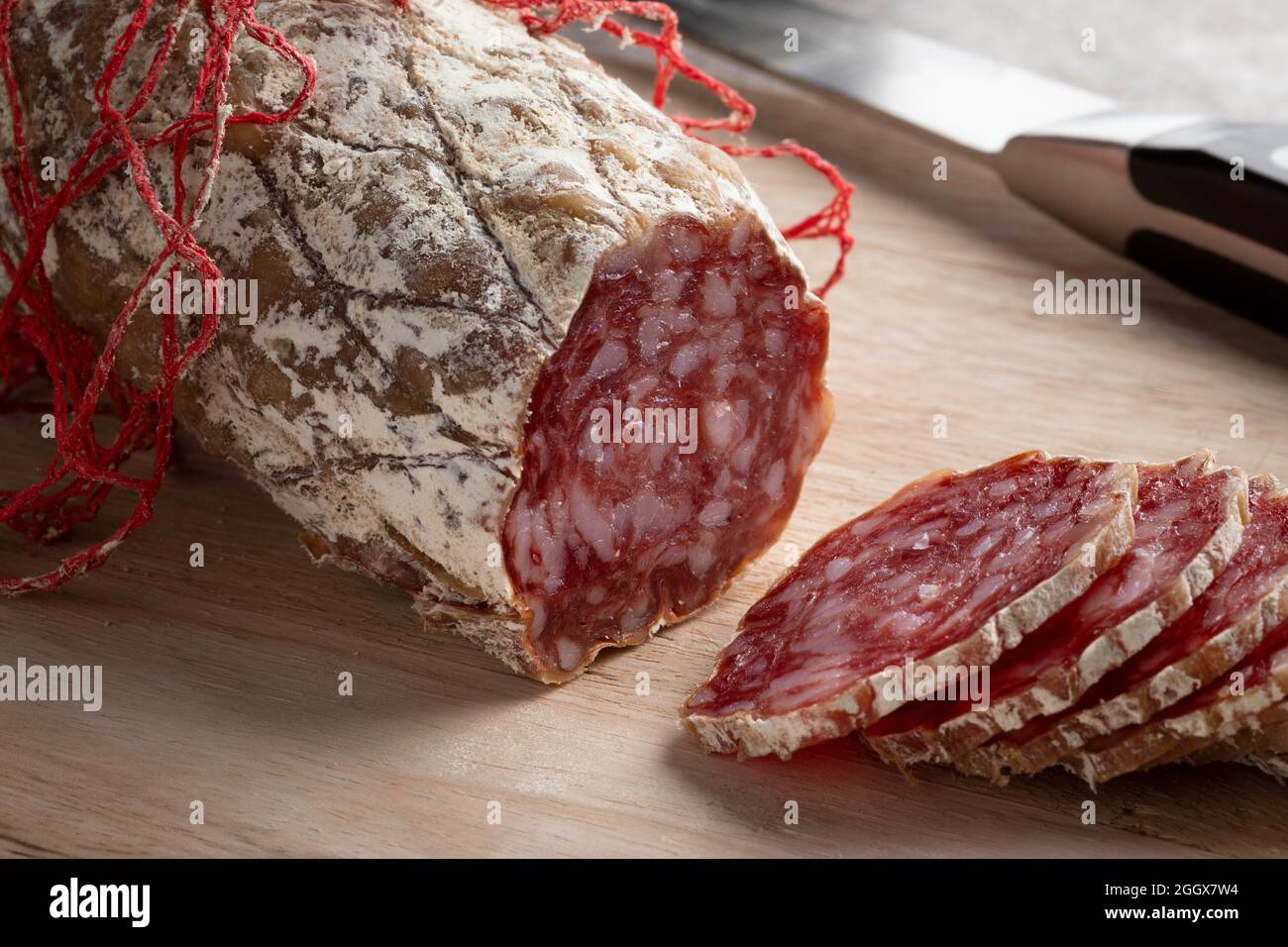 Fresh sliced Rosette de Lyon, a French pork saucisson close up Stock Photo