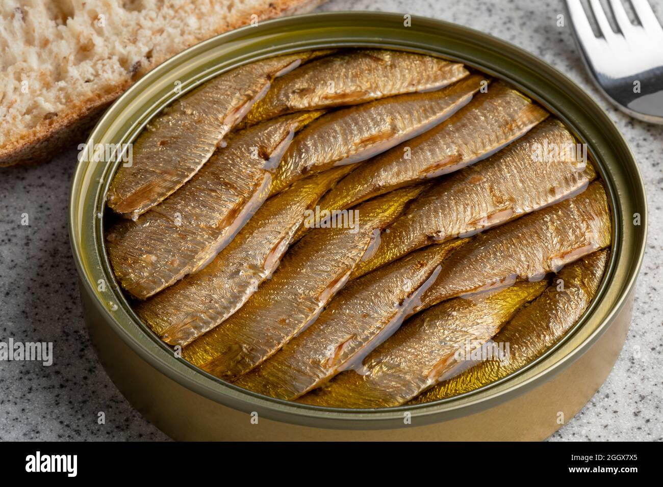 Canned smoked European sprat in oil for lunch close up Stock Photo