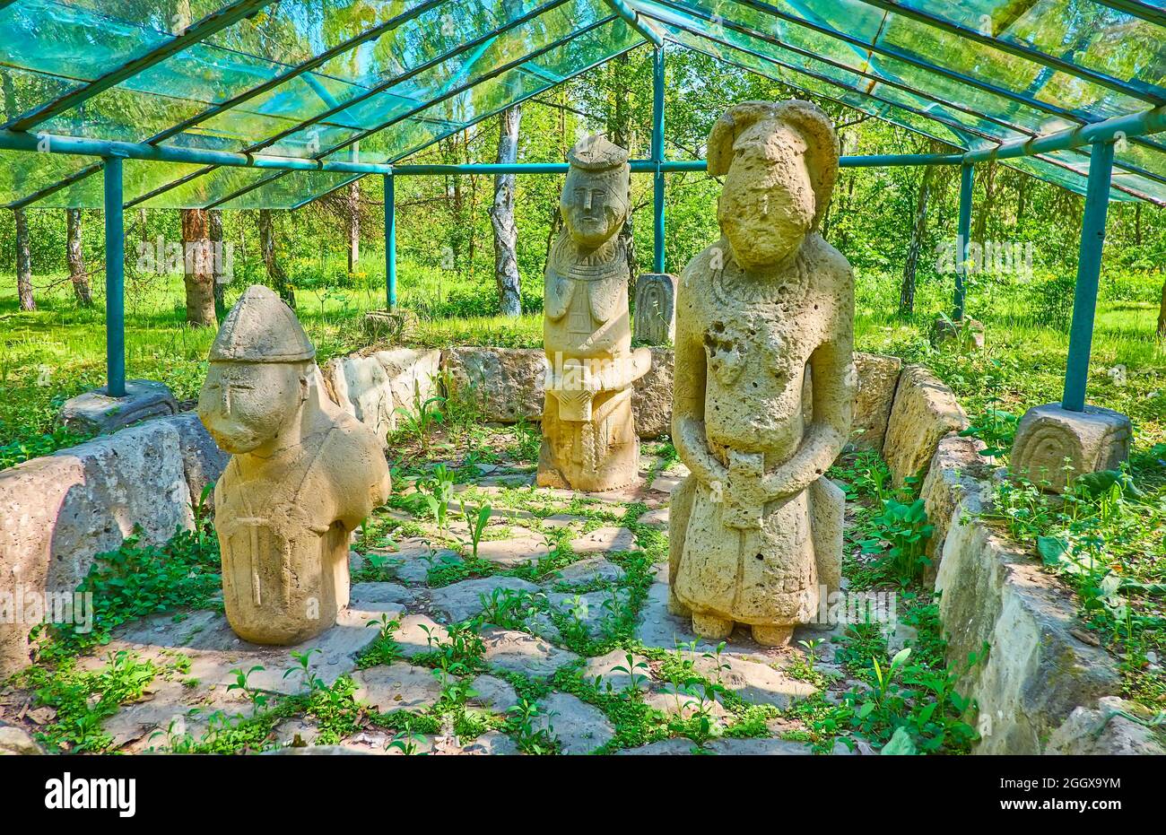 The ancient Cuman Pagan shrine with preserved stone sculptures of the warrior and women, Pereiaslav Scansen, Ukraine Stock Photo