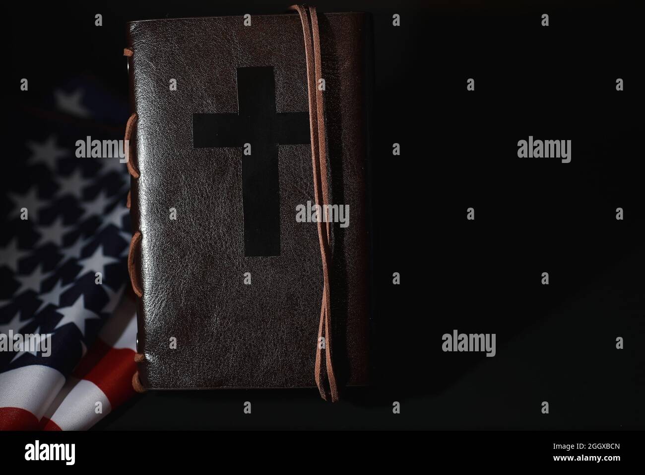 American flag and holy bible book on mirror background. Symbol of the ...