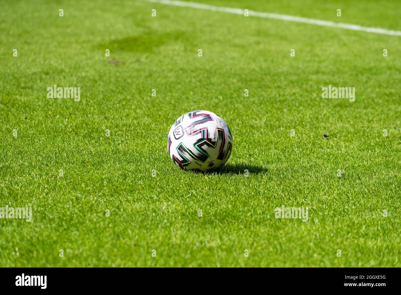 Soccer football on an green empty pitch Stock Photo