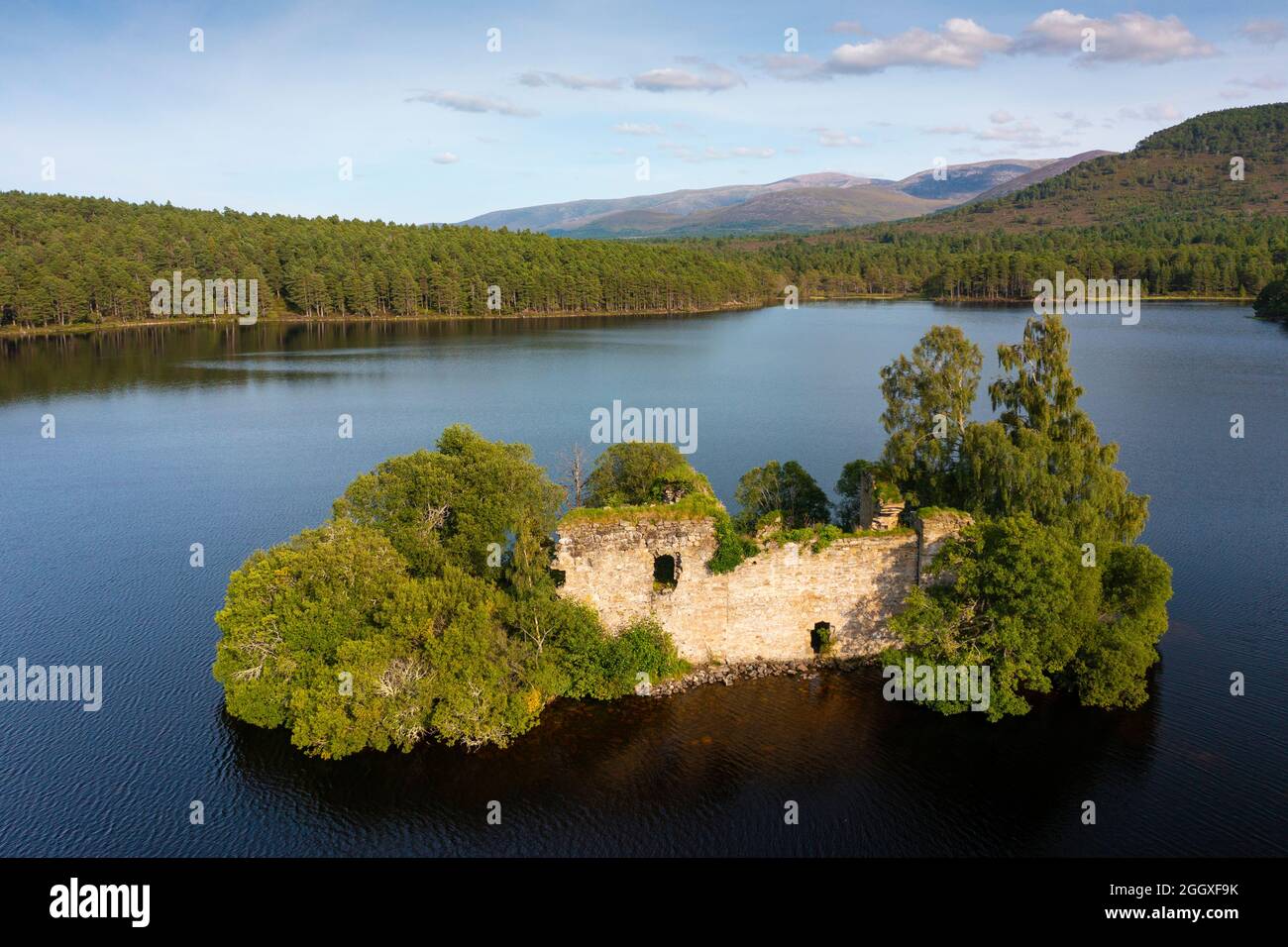 Aerial view from drone of ruin of Loch an Eilein Castle on Loch an Eilein in Rothiemurchus, Cairngorms National Park, Scotland UK Stock Photo