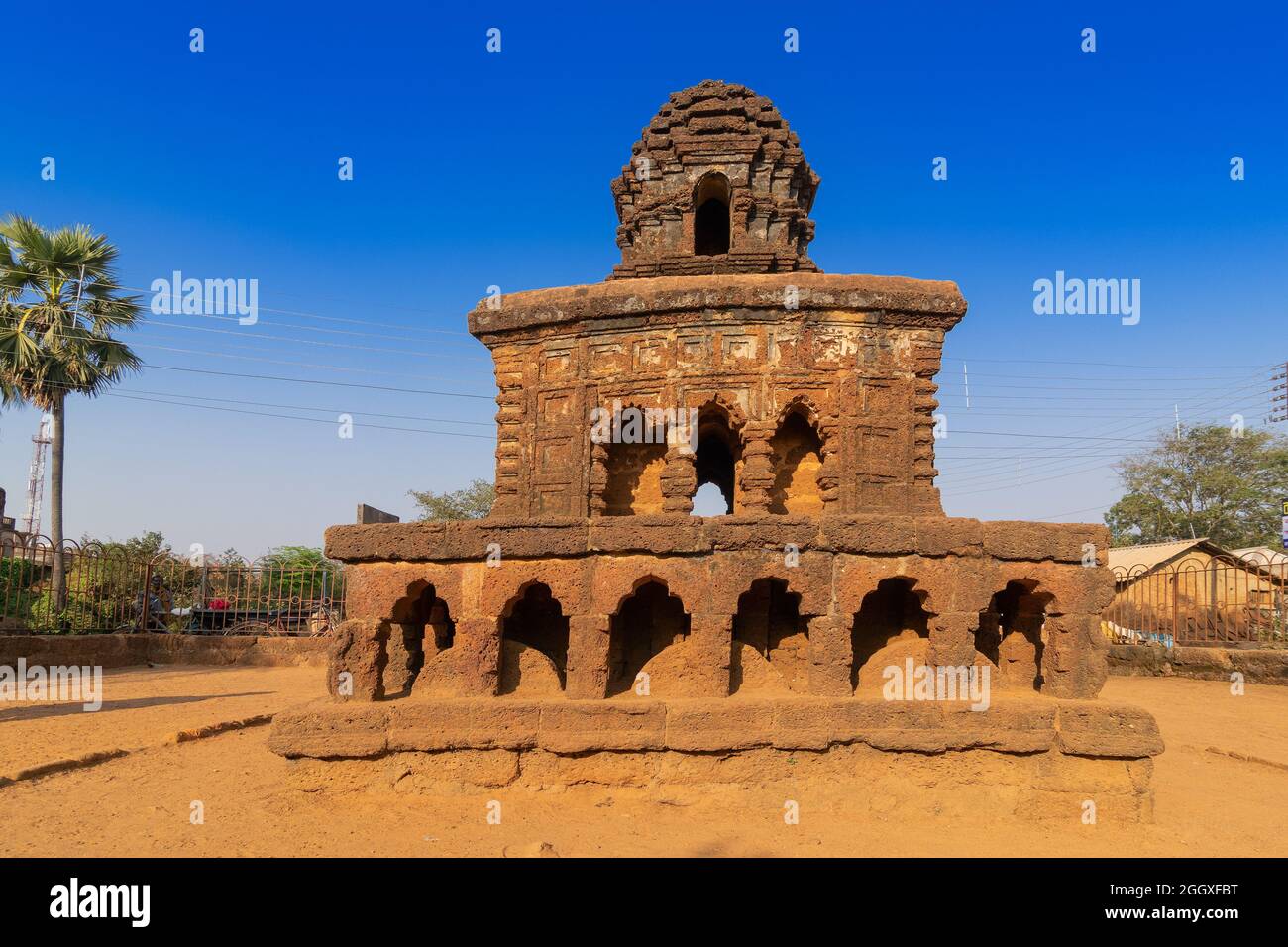 Stone chariot, conceptual model of Bishnupur temple architecture in a miniature form. Small double storied structure stands on a low laterite plinth - Stock Photo