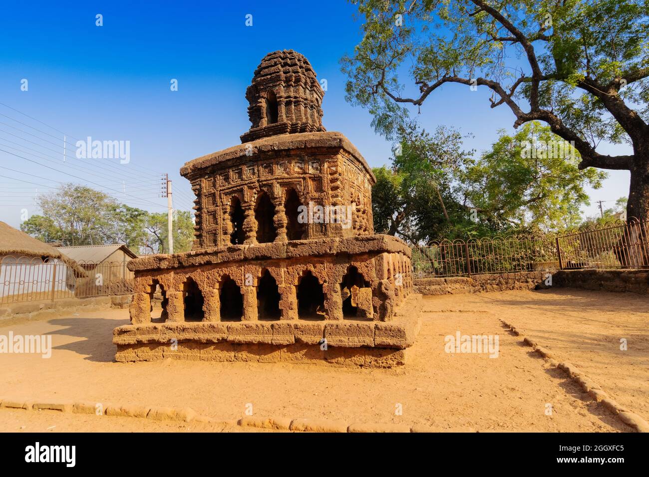 Stone chariot, conceptual model of Bishnupur temple architecture in a miniature form. Small double storied structure stands on a low laterite plinth - Stock Photo