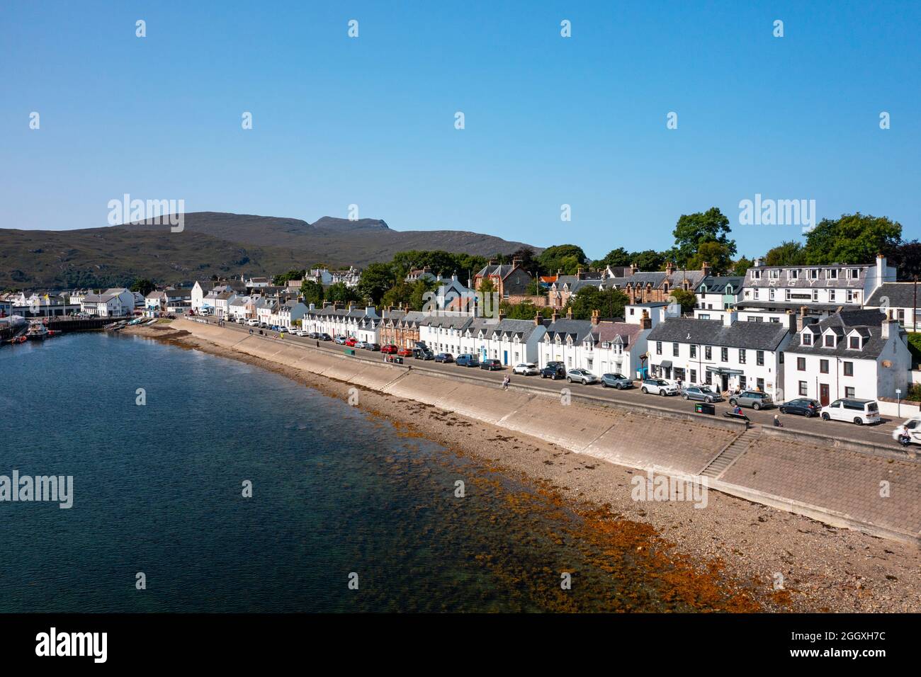 View  of row of whitewashed terraced row of houses in Ullapool, Ross and Cromarty, Highland Region, Scotland, Uk Stock Photo