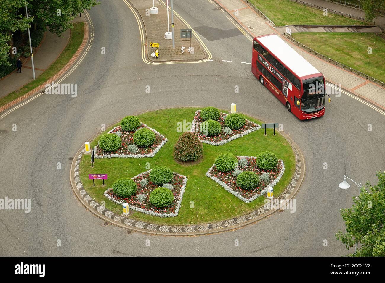 A roundabout or traffic circle. Attractively planted as a nice feature. Stock Photo