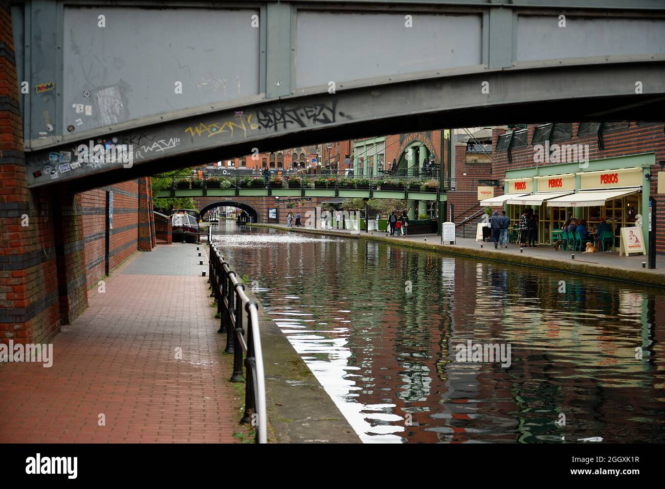 Canal, restaurants, walkway in the city of Birmingham, England. The canal quarter. Stock Photo