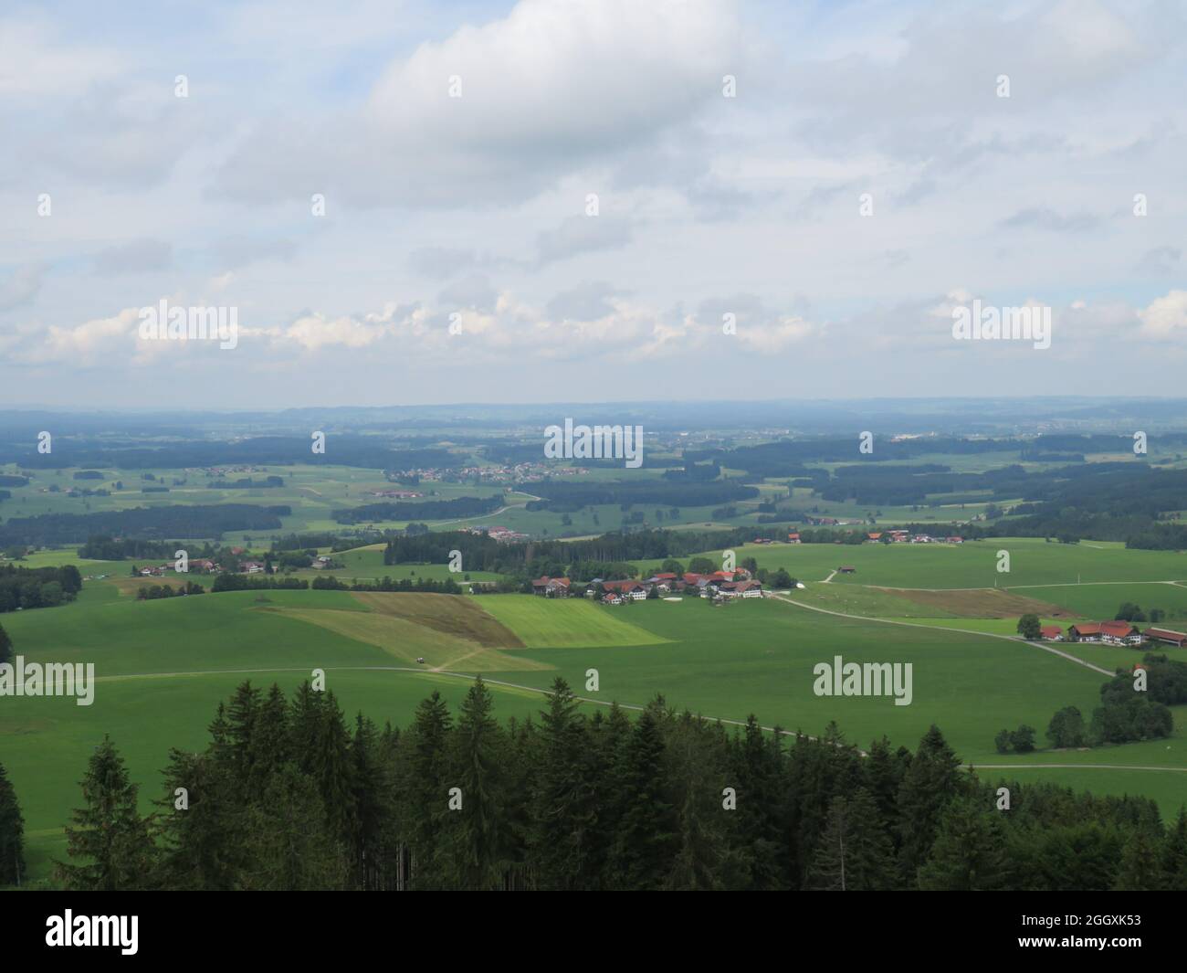 Rural houses surrounded by agricultural fields under a cloudy sky Stock ...