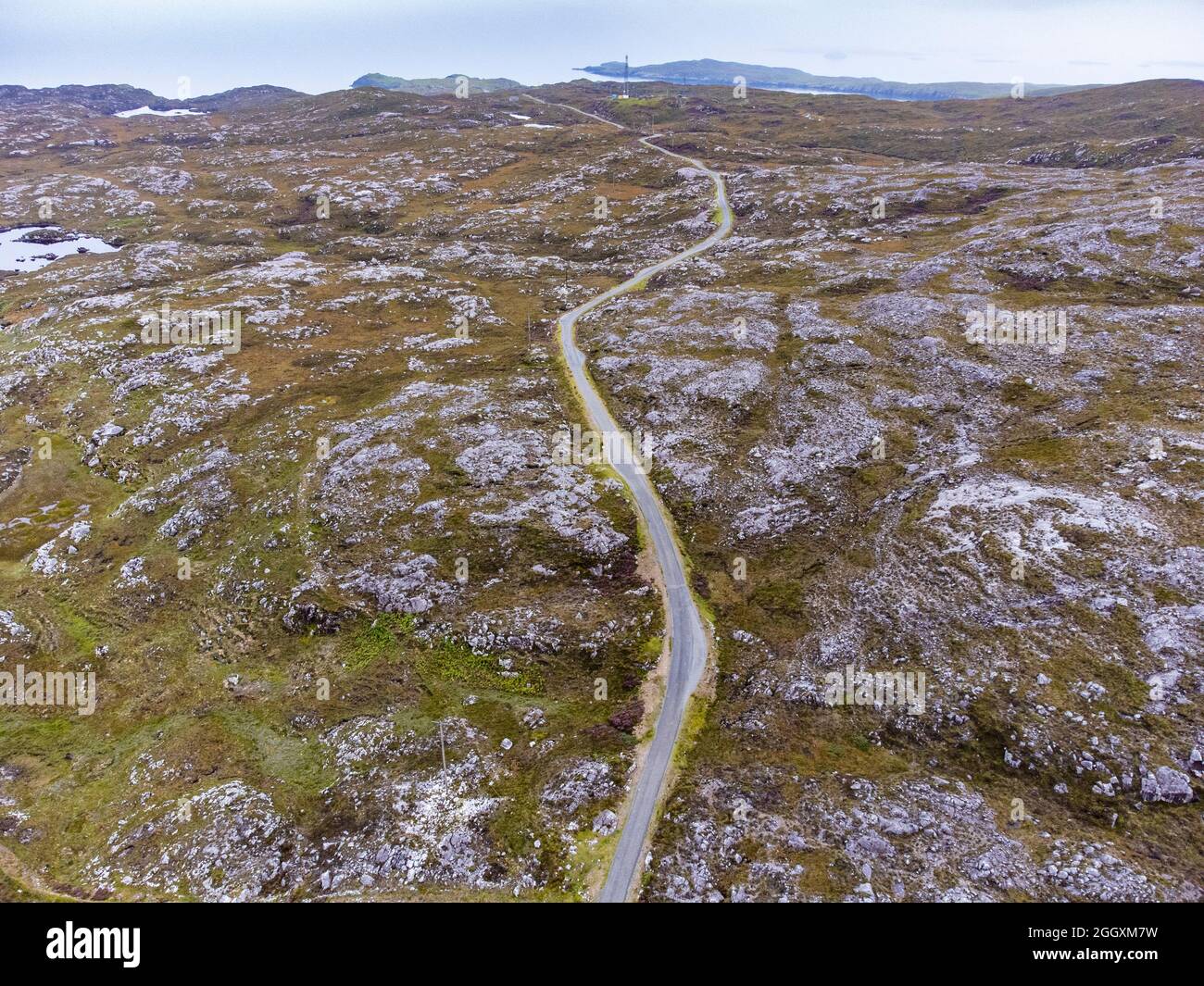 Aerial view from drone of narrow road and rocky landscape on The Bays on East coast of Isle of Harris, Outer Hebrides, Scotland, UK Stock Photo