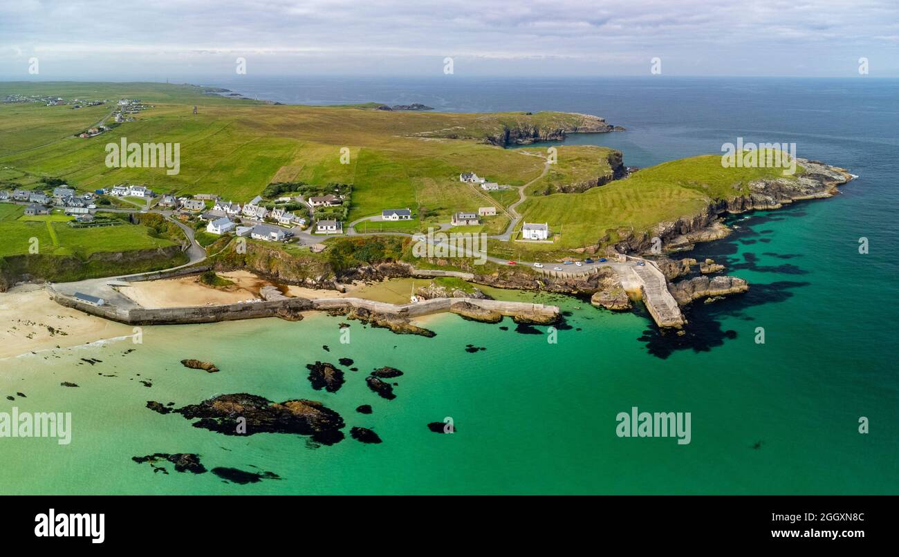 Aerial view from drone of village and harbour at Port Ness at northern tip of Isle of Lewis, Outer Hebrides, Scotland, UK Stock Photo