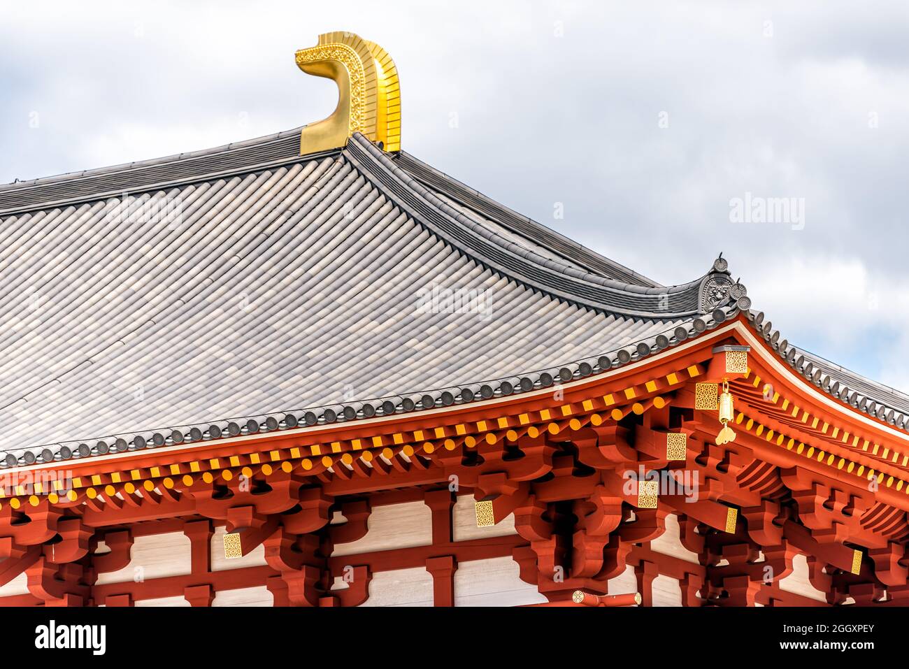 Nara, Japan famous Kofuku-ji temple Chu-Kondo Central Golden Hall in city closeup of red pagoda roof tiles and cloudy sky Stock Photo