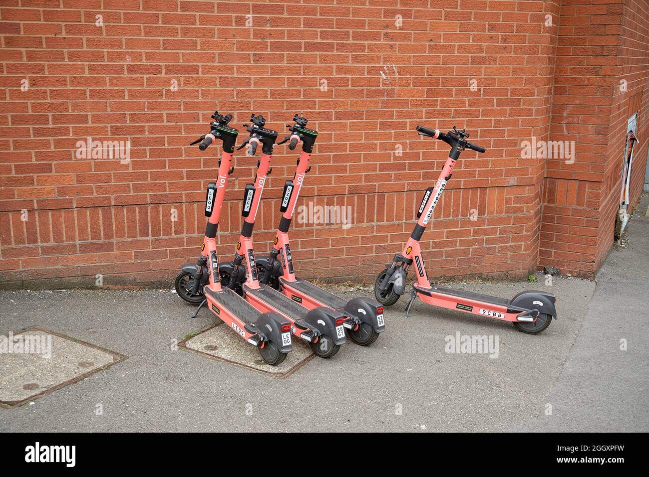 Voi Scooters parked in Birmingham, UK Stock Photo