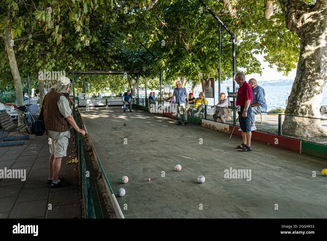 Bracciano, Italy. 03rd Sep, 2021. Italian men  enjoy playing Bocce on a hot summer day under a shaded area. Bocce is a ball sport which is similar to  British bowls and French pétanque and is played around Europe and by Italian immigrants in Australia and North America.  Credit: amer ghazzal/Alamy Live News Credit: amer ghazzal/Alamy Live News Stock Photo
