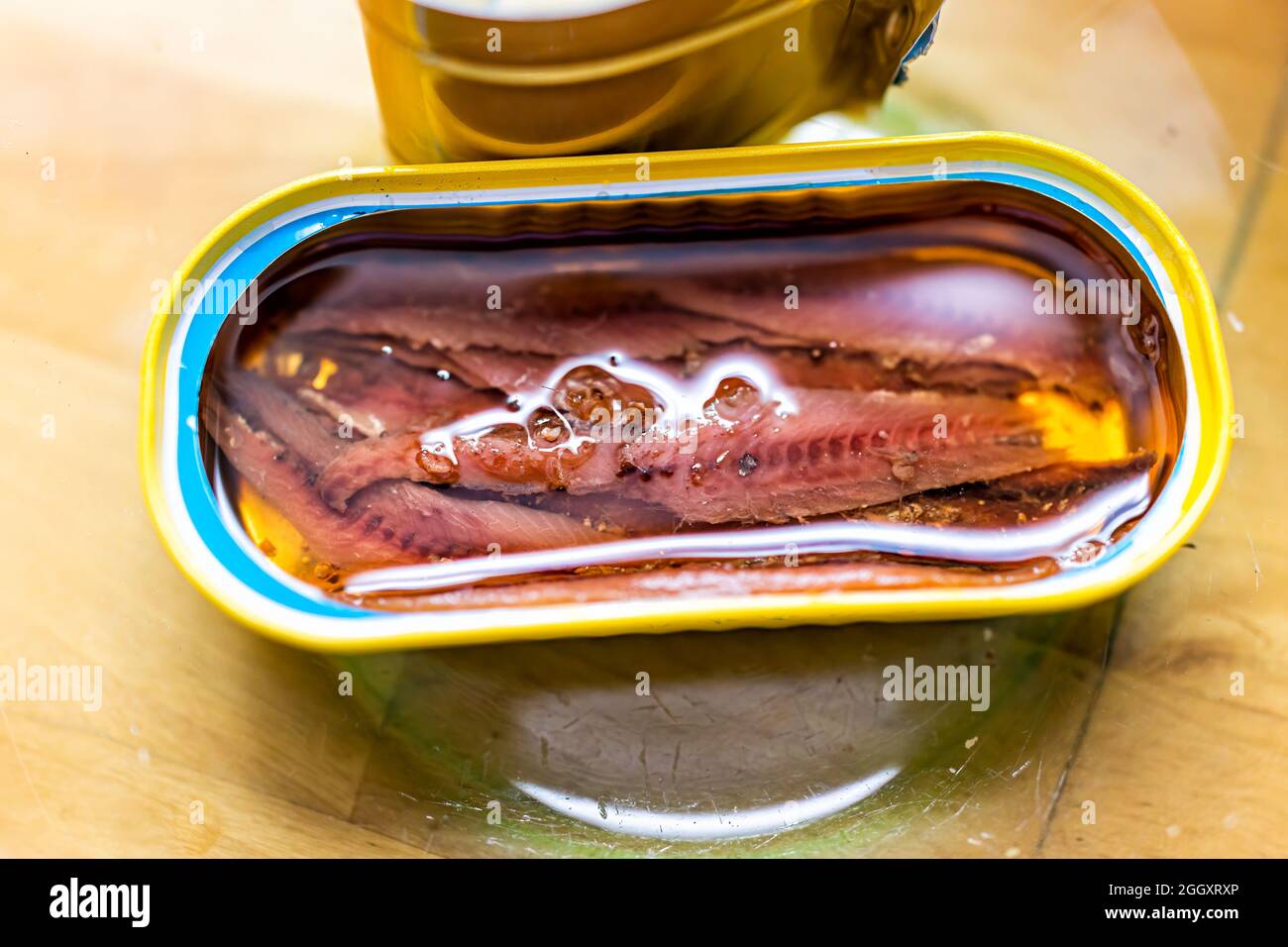 Storebought canned anchovies in oil in can with open lid wild caught