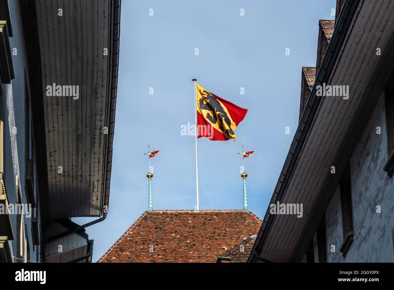 Bernese Flag on top of Bern Town Hall (Rathaus) - Bern, Switzerland Stock Photo