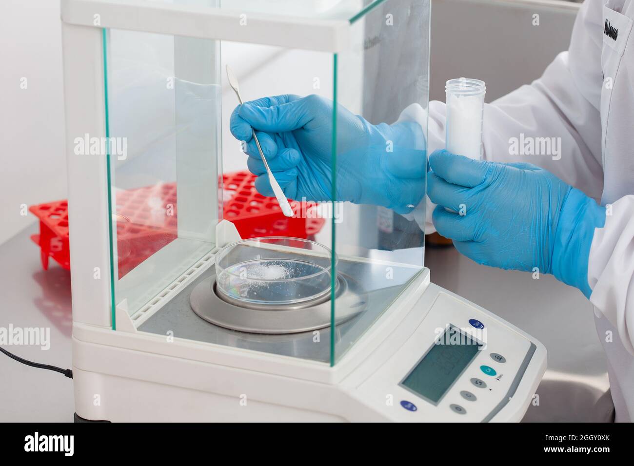 Scientist using an analytical balance at laboratory Stock Photo - Alamy