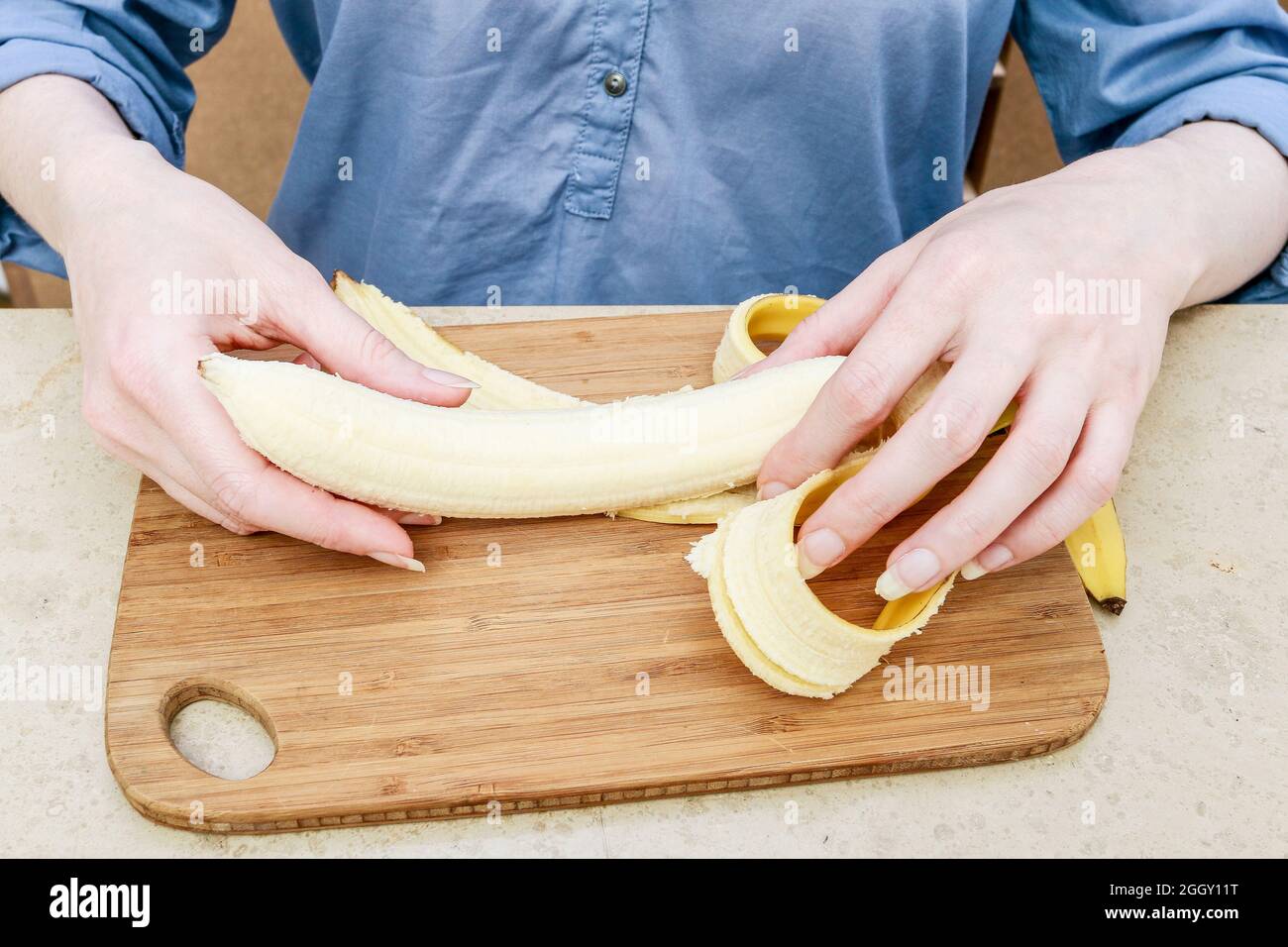 woman-peeling-a-banana-cooking-time-stock-photo-alamy