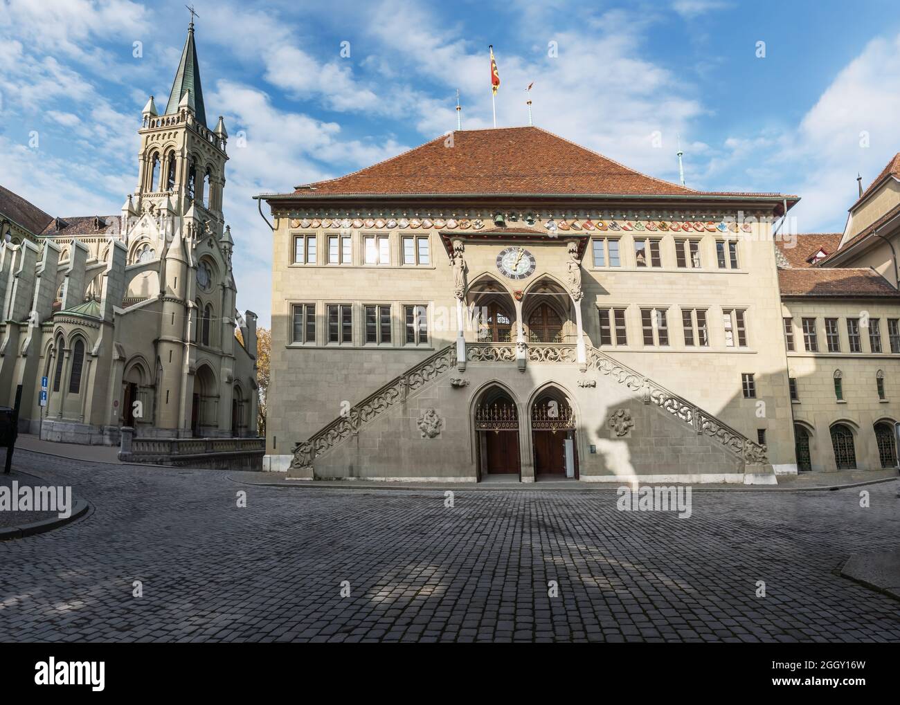 Bern Town Hall (Rathaus) and Church of St Peter and Paul - Bern, Switzerland Stock Photo