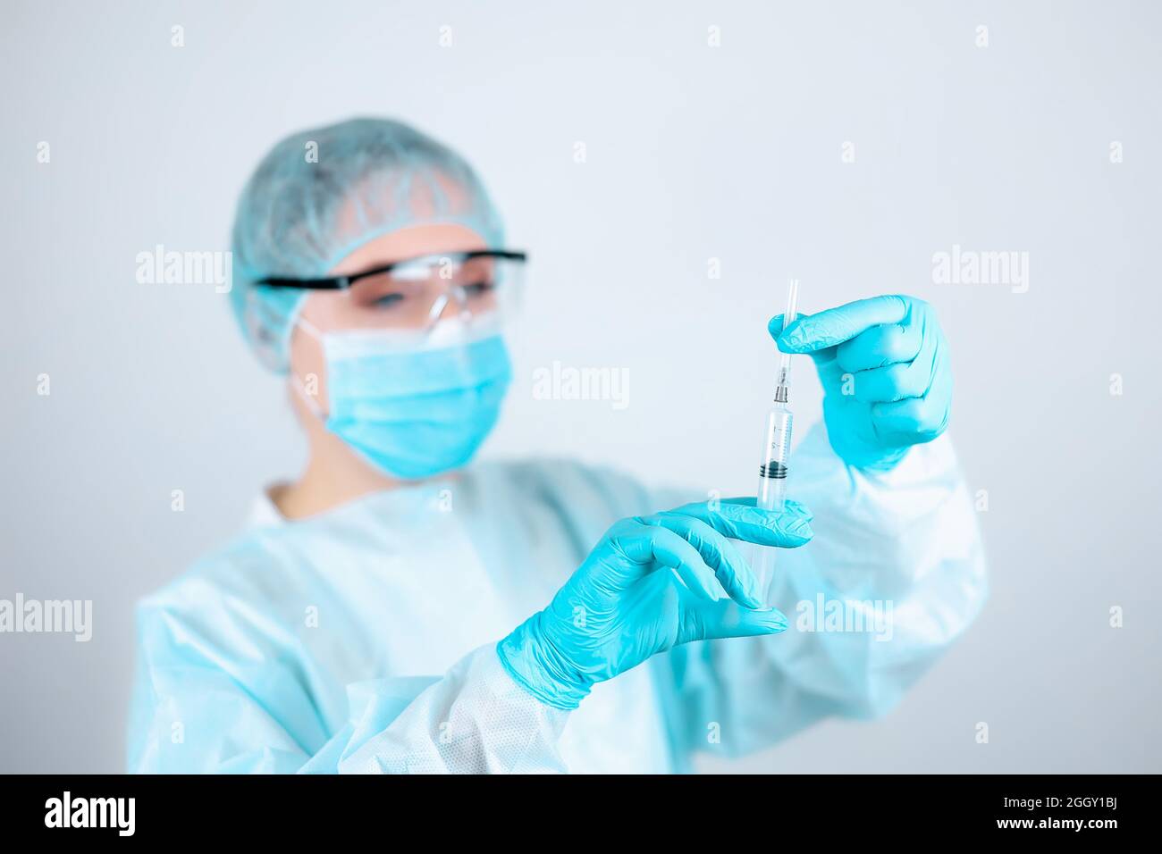 Nurse glasses mask cap gloves gown hi-res stock photography and images ...