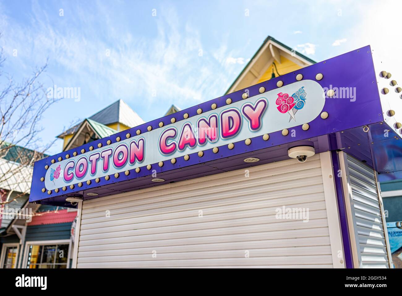 Destin, USA - January 13, 2021: Cotton candy kiosk stall or stand on famous street boardwalk in Destin selling sweet dessert in Harborwalk Village, Fl Stock Photo