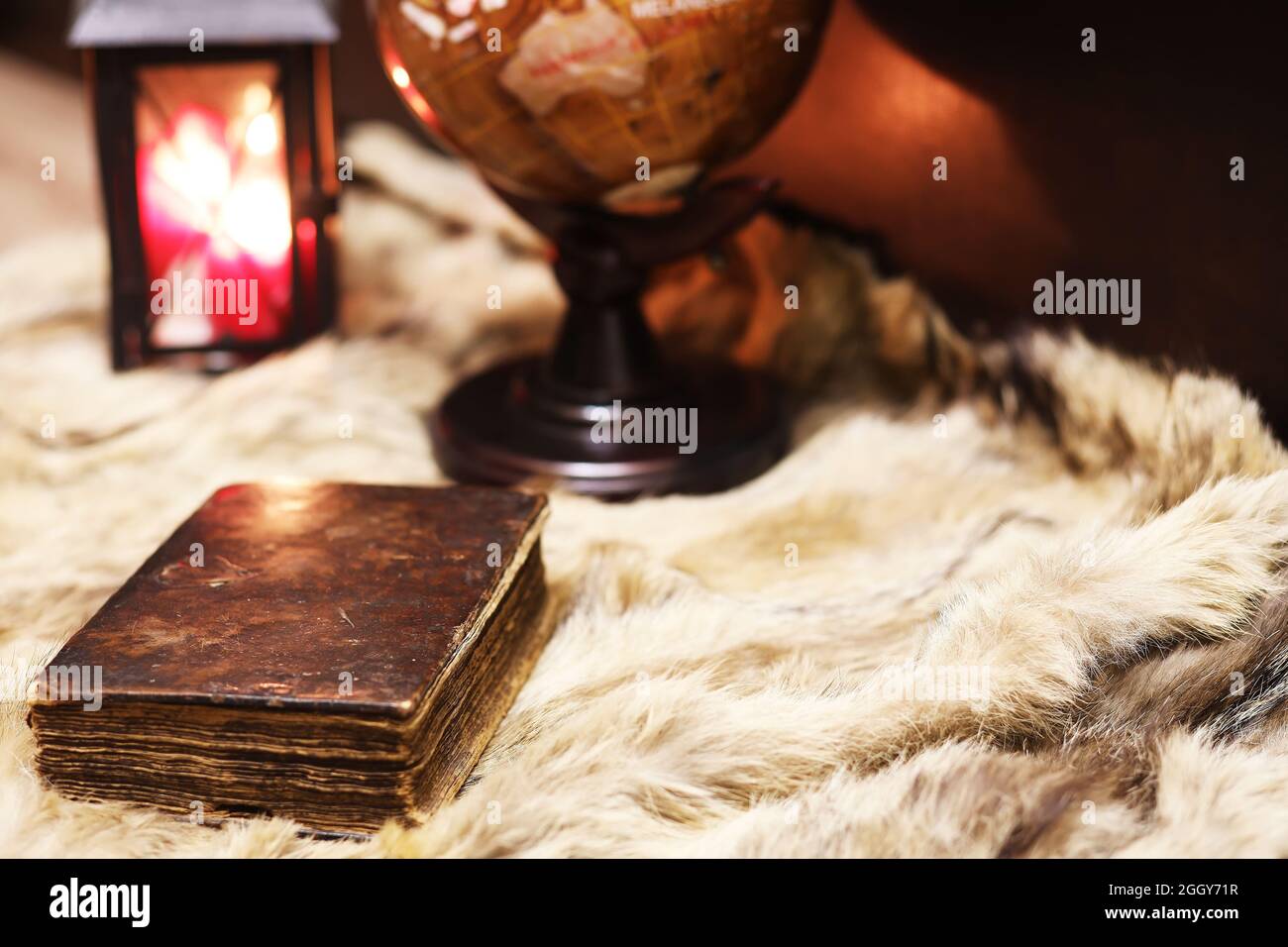 Retro old book and world desk globe fur, learning and education concepts. Stock Photo