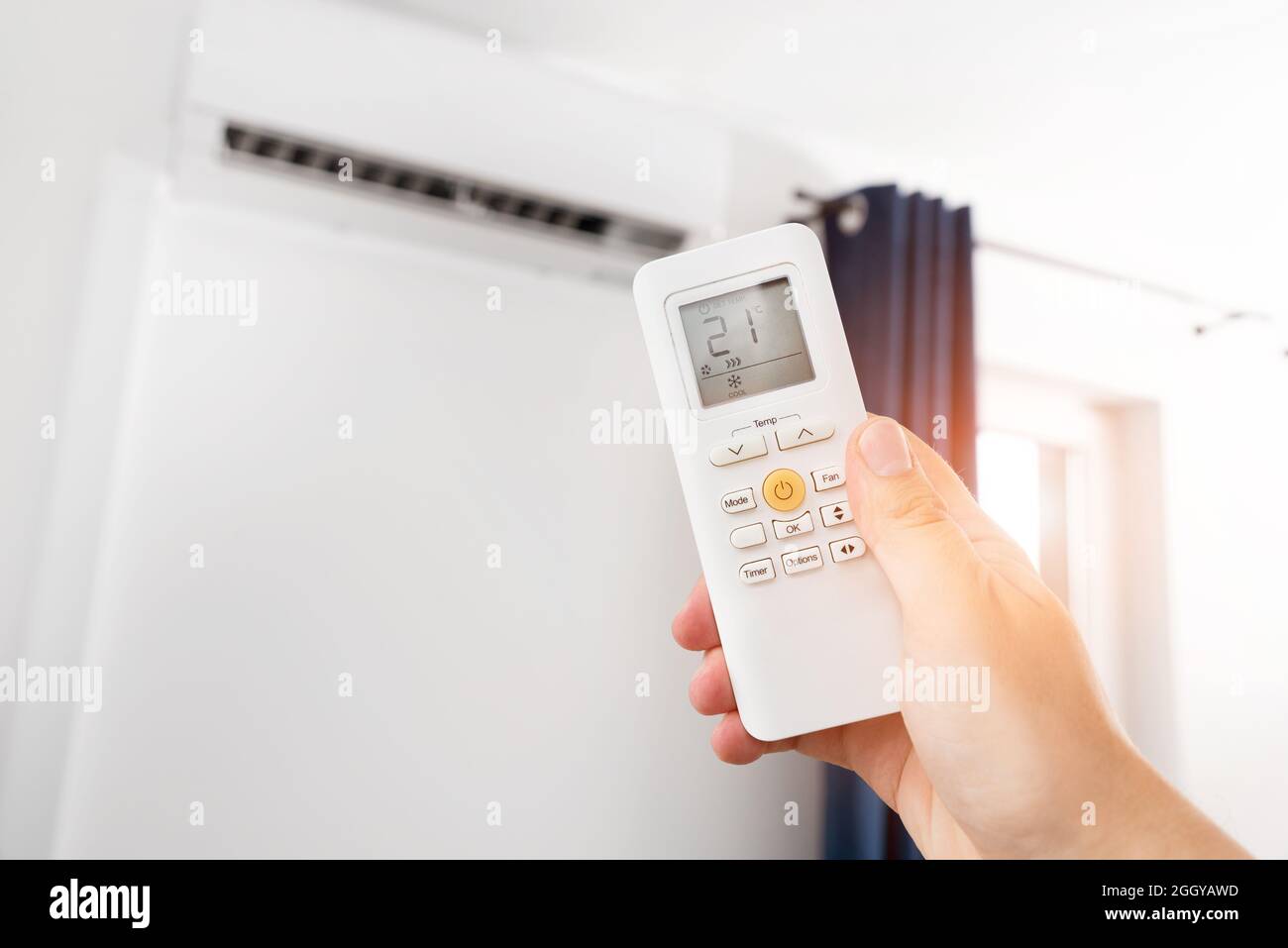 Adjusting temperature of air conditioner by remote. Air conditioning
