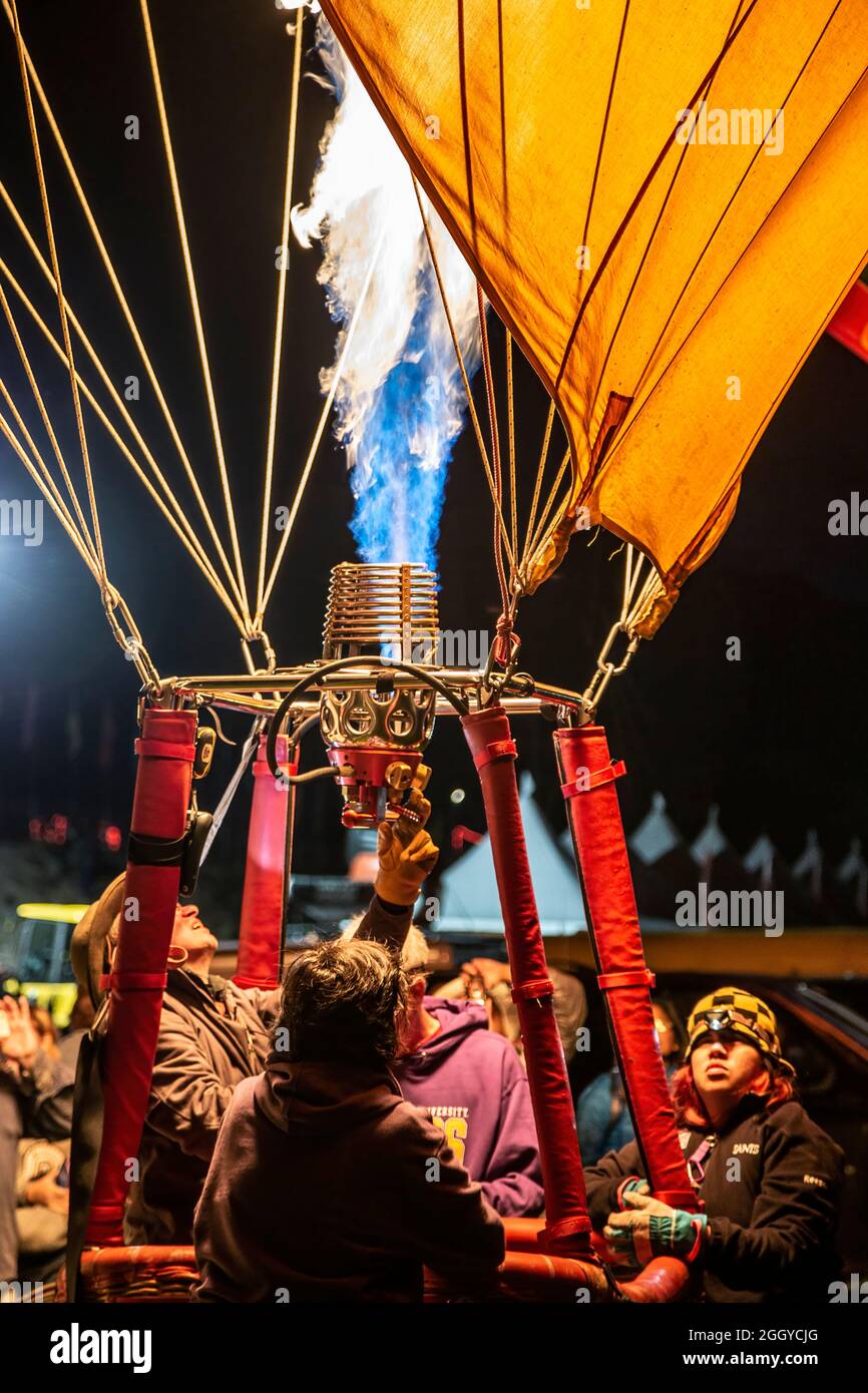 Crew inflating hot air balloon with propane flame, Albuquerque International Balloon Fiesta, Albuquerque, New Mexico USA Stock Photo