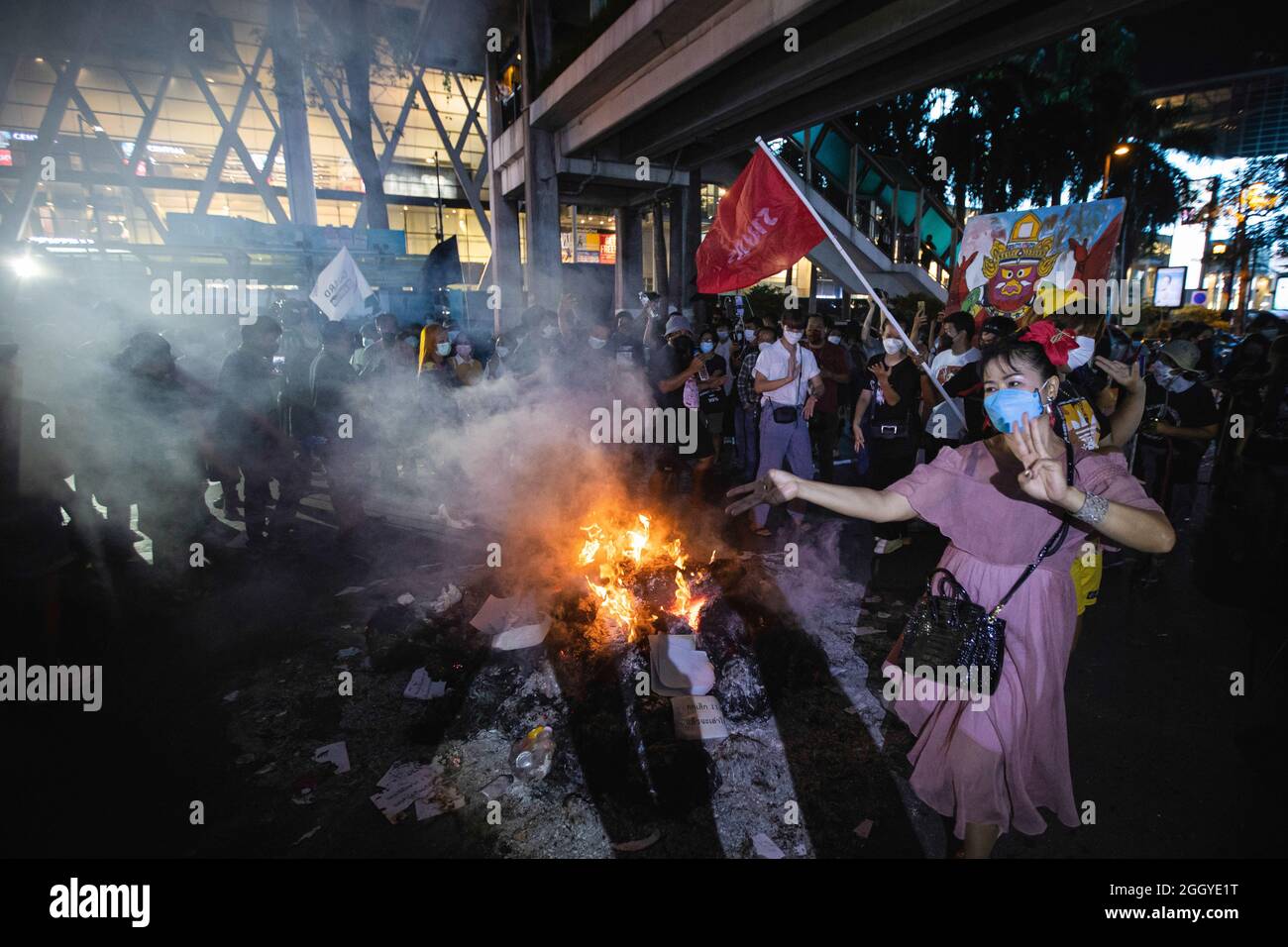 Bangkok, Thailand. 03rd Sep, 2021. Protesters are seen dancing around the bonfire during the demonstration. Pro-democracy protesters group named ìThammasat UFTDî (United Front of Thammasat and Demonstration) held a protest on Ratchaprasong road demanding the monarchy reformation, abolish lese majeste law, constitutional reform, and resignation of Prime Minister Prayut Chan-ocha. Credit: SOPA Images Limited/Alamy Live News Stock Photo