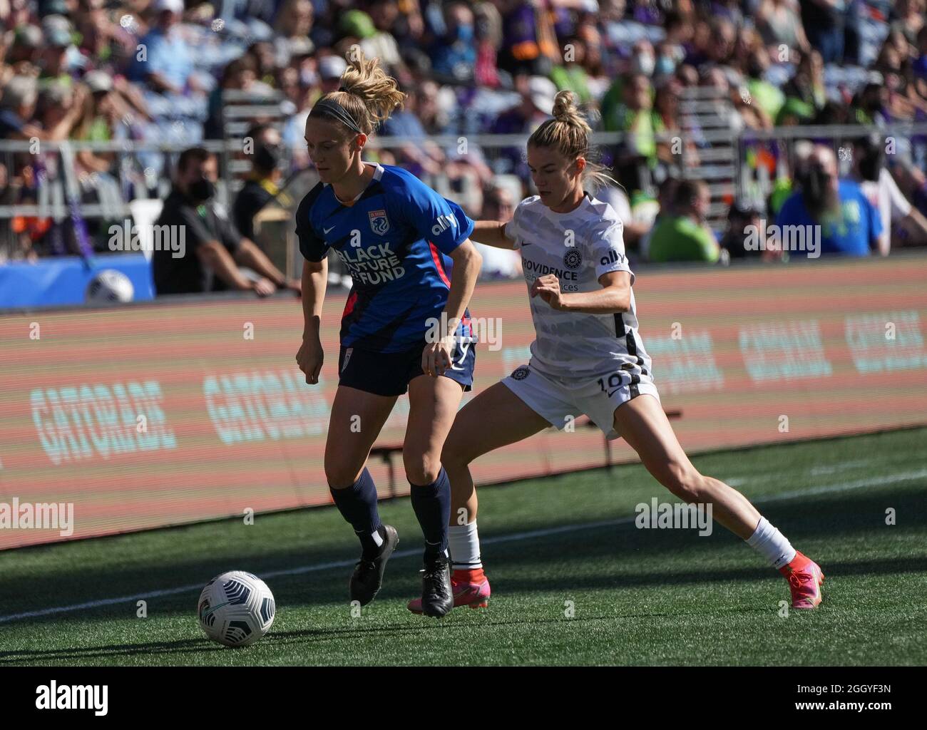 Seattle, WA, USA. 29th Aug, 2021. NWSL Soccer 2021 - Portland Thorns vs OL Reign: OL Reign defender Kristen McNabb (19) and Portland Thorns FC defender Christen Westphal (18) battle for the ball during a NWSL match between the Portland Thorns and the OL Reign on August 29, 2021 at Lumen Field in Seattle, WA. (Credit Image: © Jeff Halstead/ZUMA Press Wire) Stock Photo