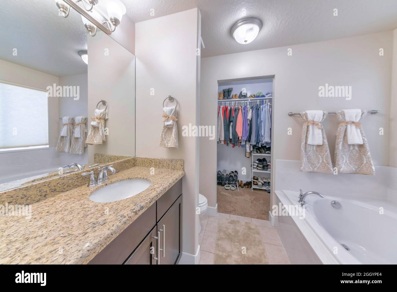 Interior of a traditional bathroom with a carpeted walk-in closet Stock Photo