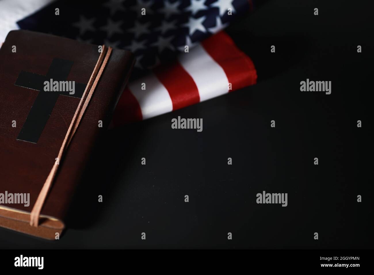 American flag and holy bible book on mirror background. Symbol of the ...
