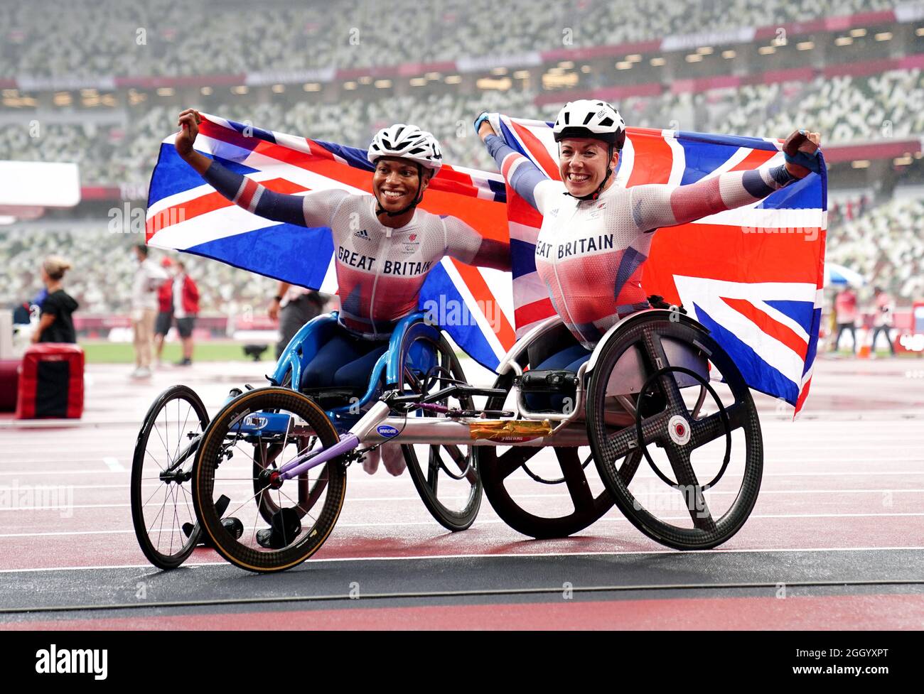 Great Britain's Hannah Cockroft (right) celebrates winning the Women's 800m T34 Final with Great Britain's Kare Adenegan who finished in second place at the Olympic Stadium during day eleven of the Tokyo 2020 Paralympic Games in Japan. Picture date: Saturday September 4, 2021. Stock Photo