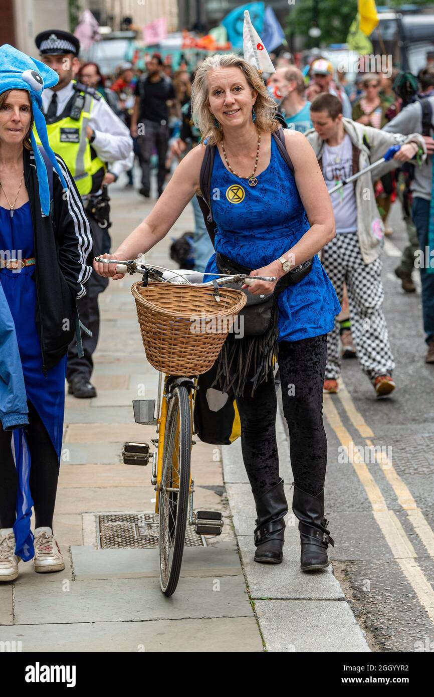 London, UK. 03rd Sep, 2021. Gail Bradbrook the co-founder of the rebellion is seen with a bicycle, during Extinction Rebellion's 'Flood Money' protest on day 13 of the Impossible Rebellion where they focused on flooding, water and the sea. Credit: SOPA Images Limited/Alamy Live News Stock Photo