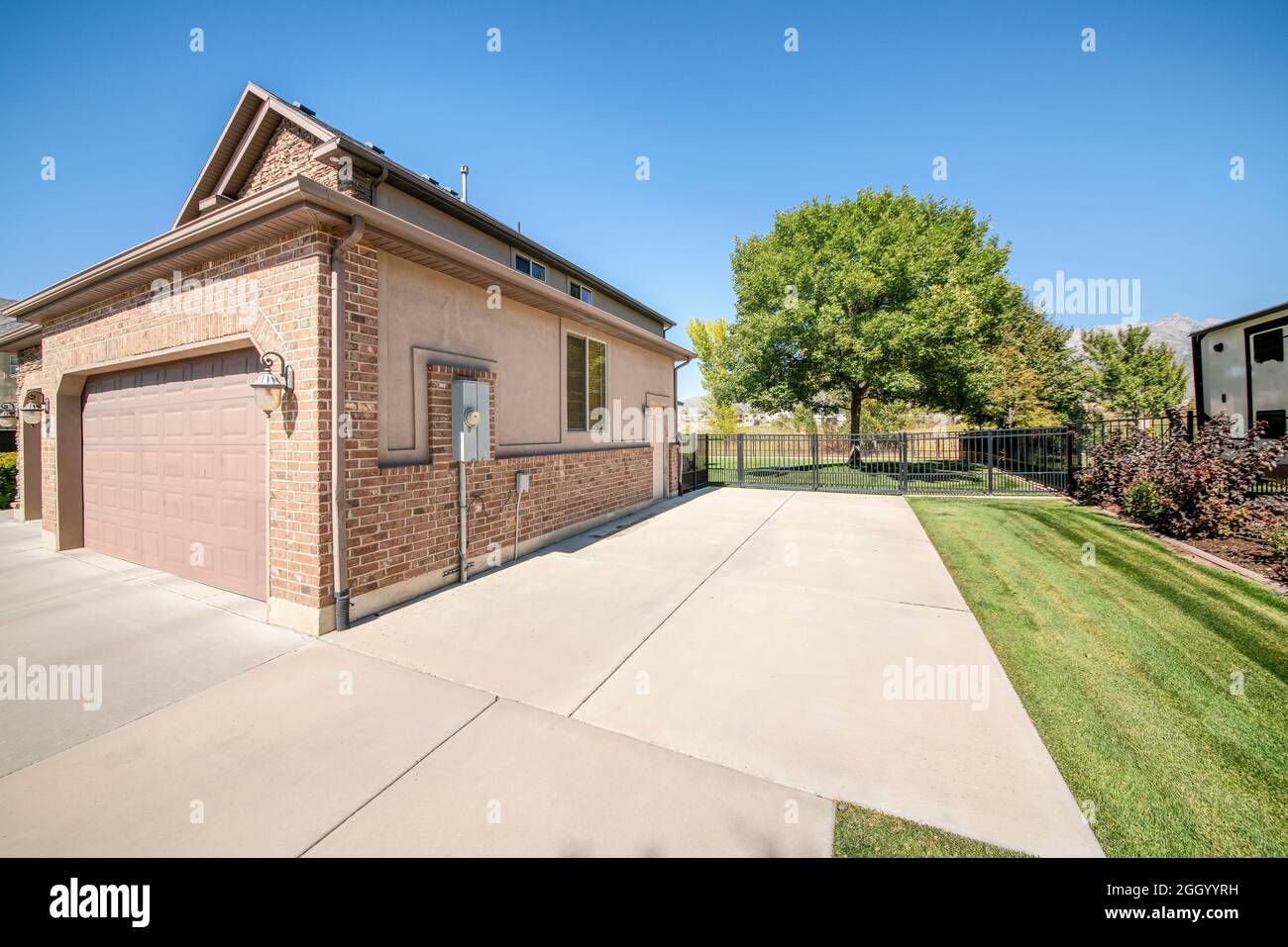 Detached garage exterior with bricks and clipped corner sectional door