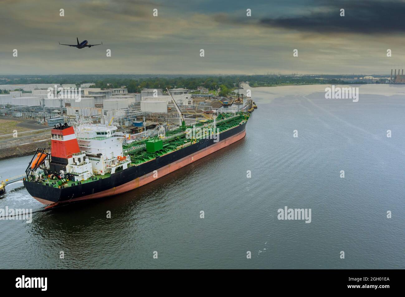 Crude oil tanker is uploading in the port terminal Stock Photo