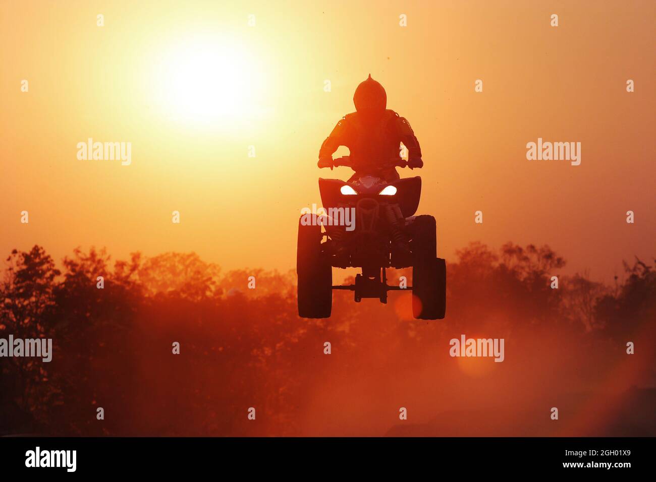 Silhouette ATV jump Stock Photo