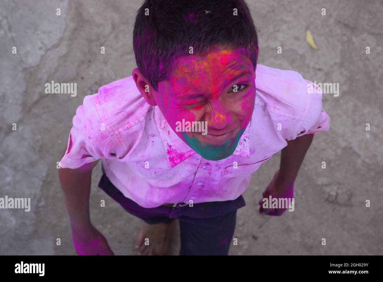 Boy playing with colors, In a happy mood. Concept for Indian festival Holi Stock Photo