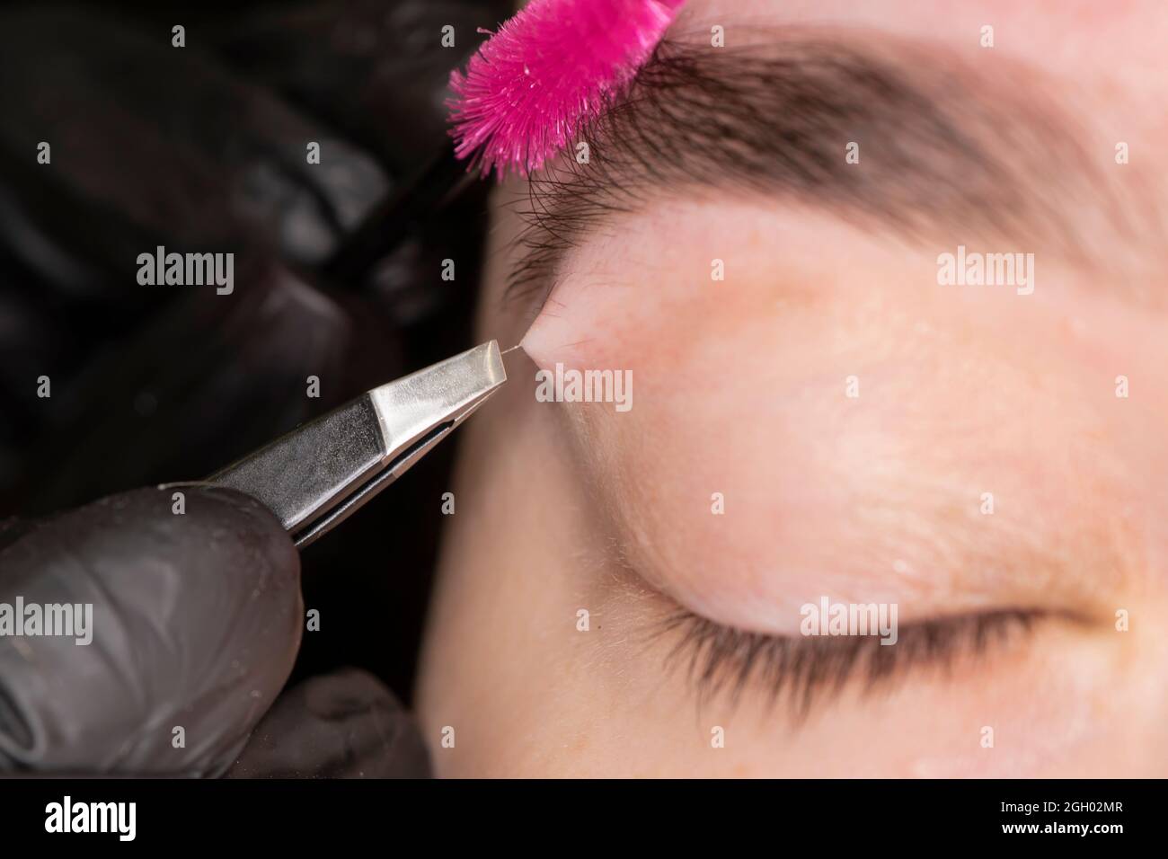 Makeup. Eyebrow Makeup. pulling out the hair in the eyebrows. Closeup