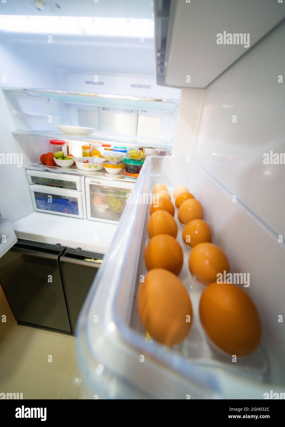Food inside refrigerator in the kitchen Stock Photo