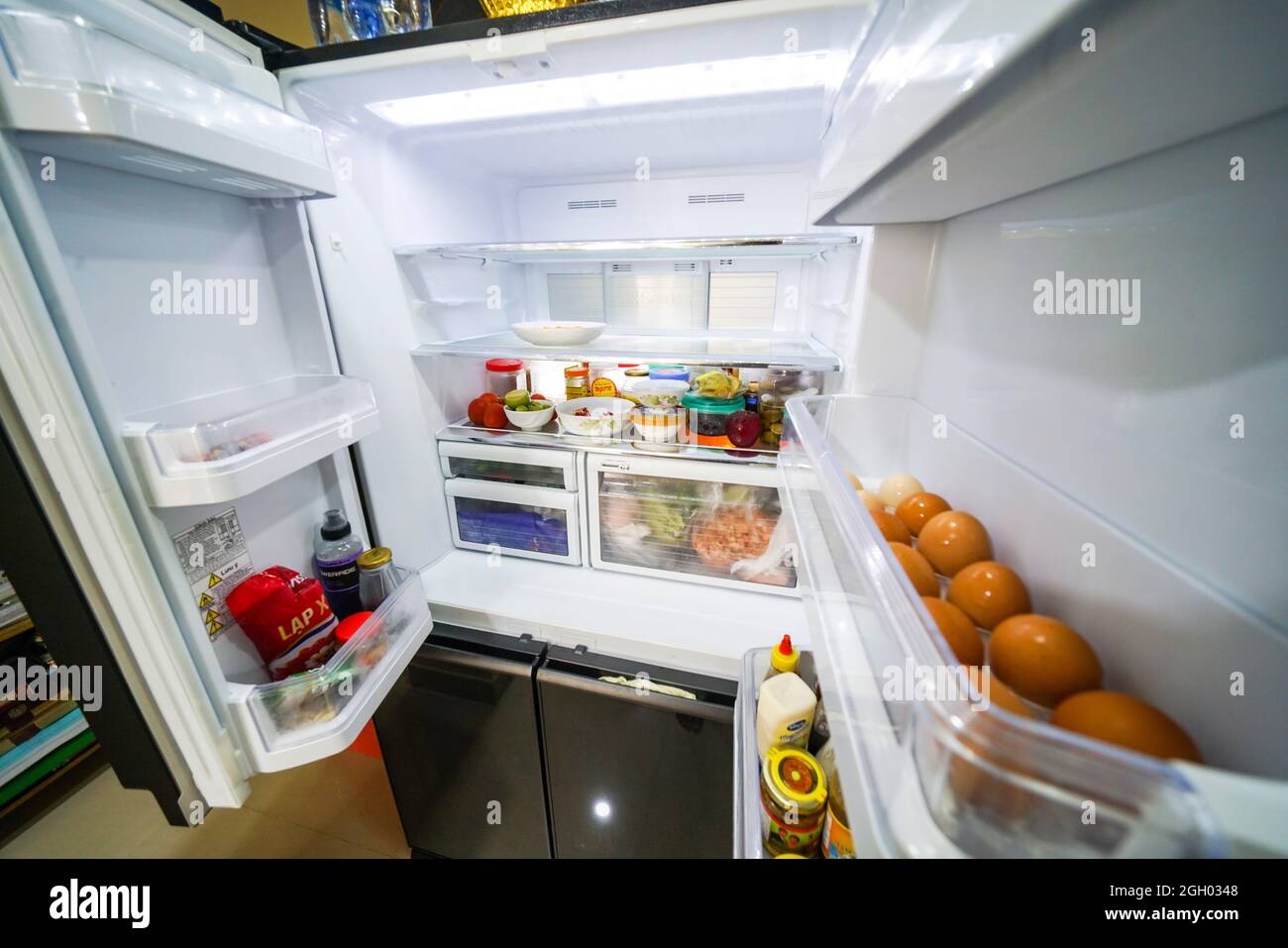 Food inside refrigerator in the kitchen Stock Photo