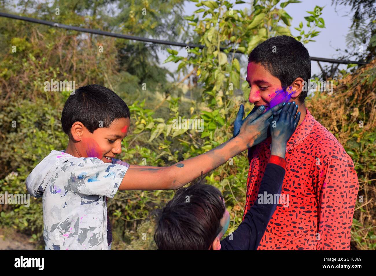 Two boys are playing in colors in happy posture, Concept for Indian festival Holi Stock Photo