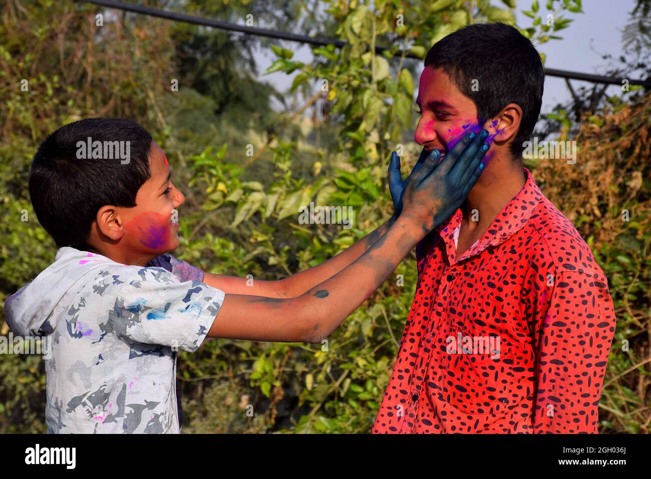 Two boys are playing in colors in happy posture, Concept for Indian festival Holi Stock Photo