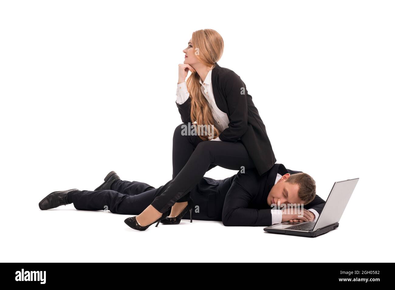Tired man and dreamy woman with laptop Stock Photo