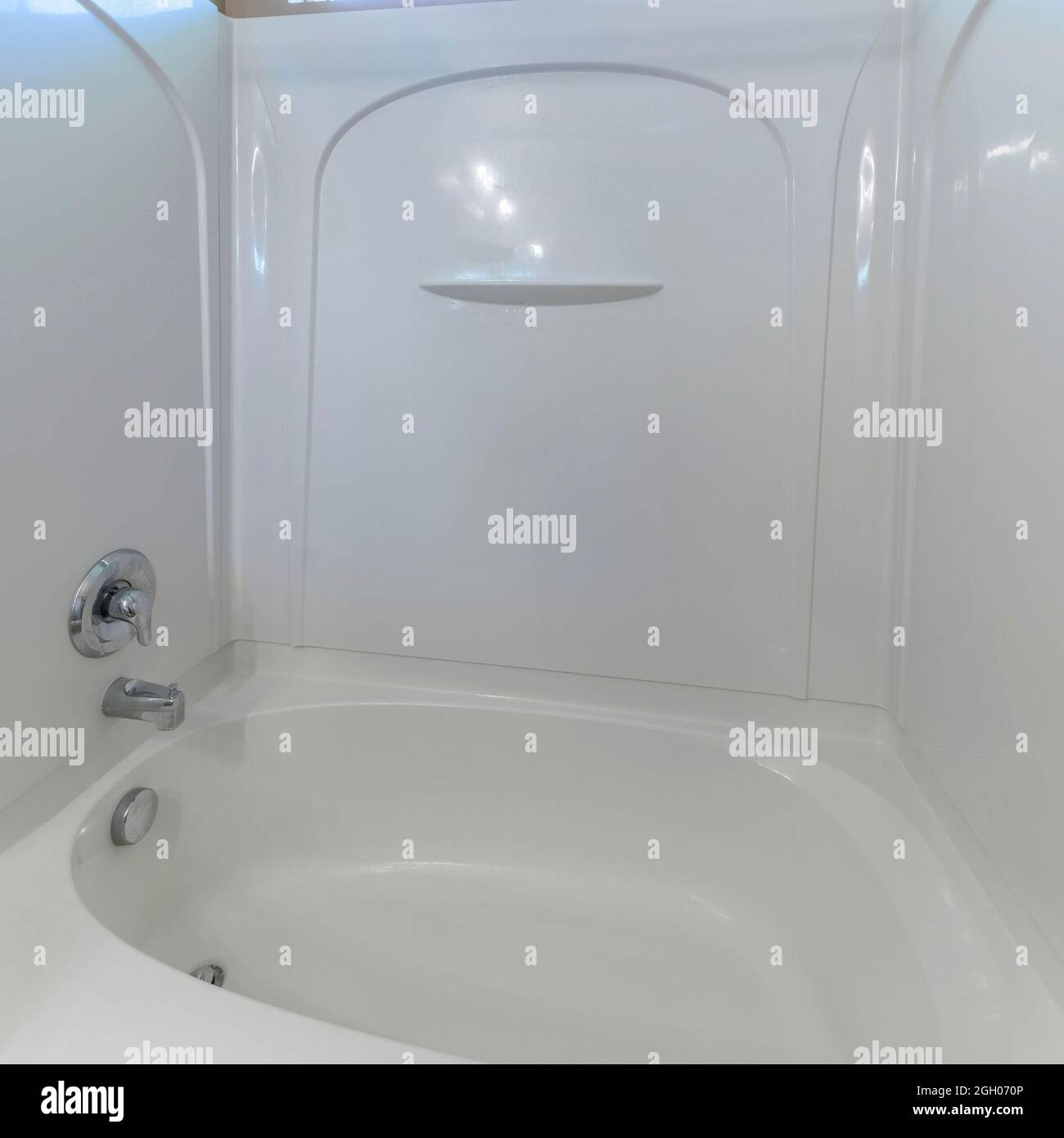 Square frame Bathtub with acrylic surround on the wall and wall mounted